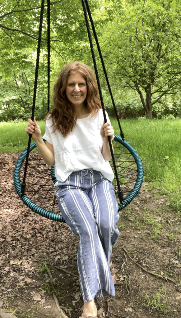 Katie on a swing outside